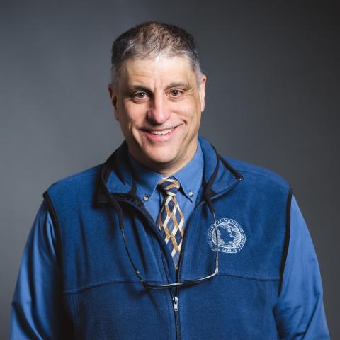 Frank Pazzaglia headshot with a grey background